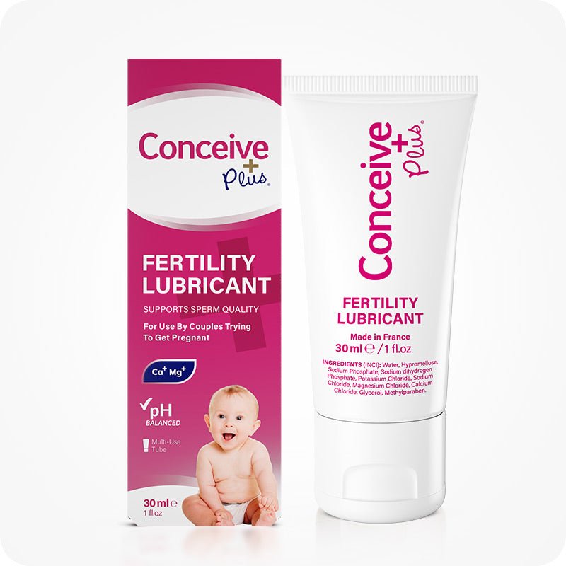 The image of the box and tube of Conceive Plus Fertility Lubricant 30ml on a white background. The box is placed on the left side of the frame while the tube of the lubricant is placed on the right side of the frame. The front side of both the box and the lubricant tube are towards the camera.