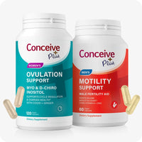 The image of Conceive Plus Motility and Ovulation Support Bundle on a white background. The image of Conceive Plus Ovulation Support bottle is on the left side of the frame with two capsules outside the bottle on the lower left corner of the bottle. The image of Conceive Plus Motility Support bottle is on the right side of the frame with two capsules outside of the bottle on the lower right corner of the bottle. Both bottles are placed side by side.